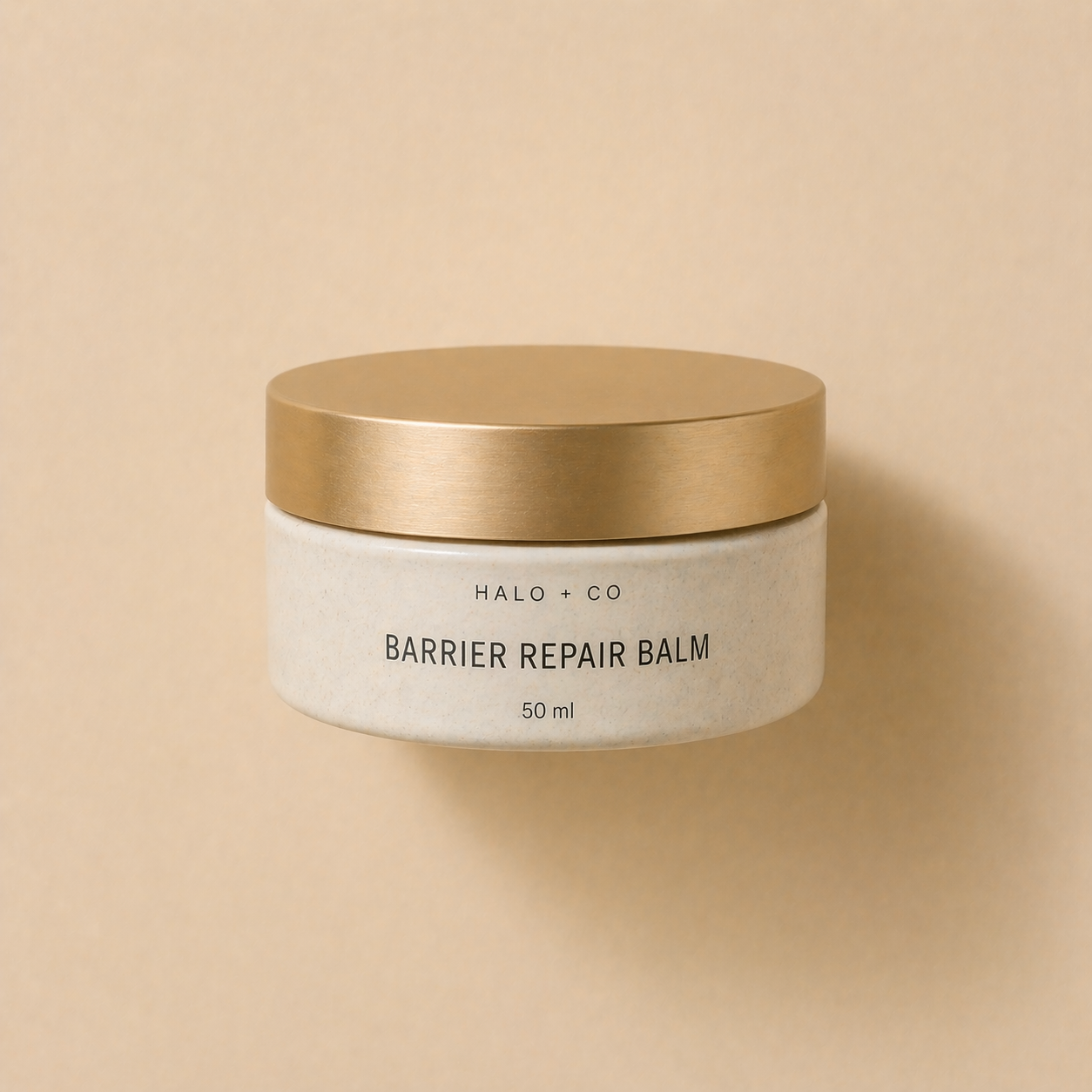 Halo + Co Barrier Repair Balm on warm beige background