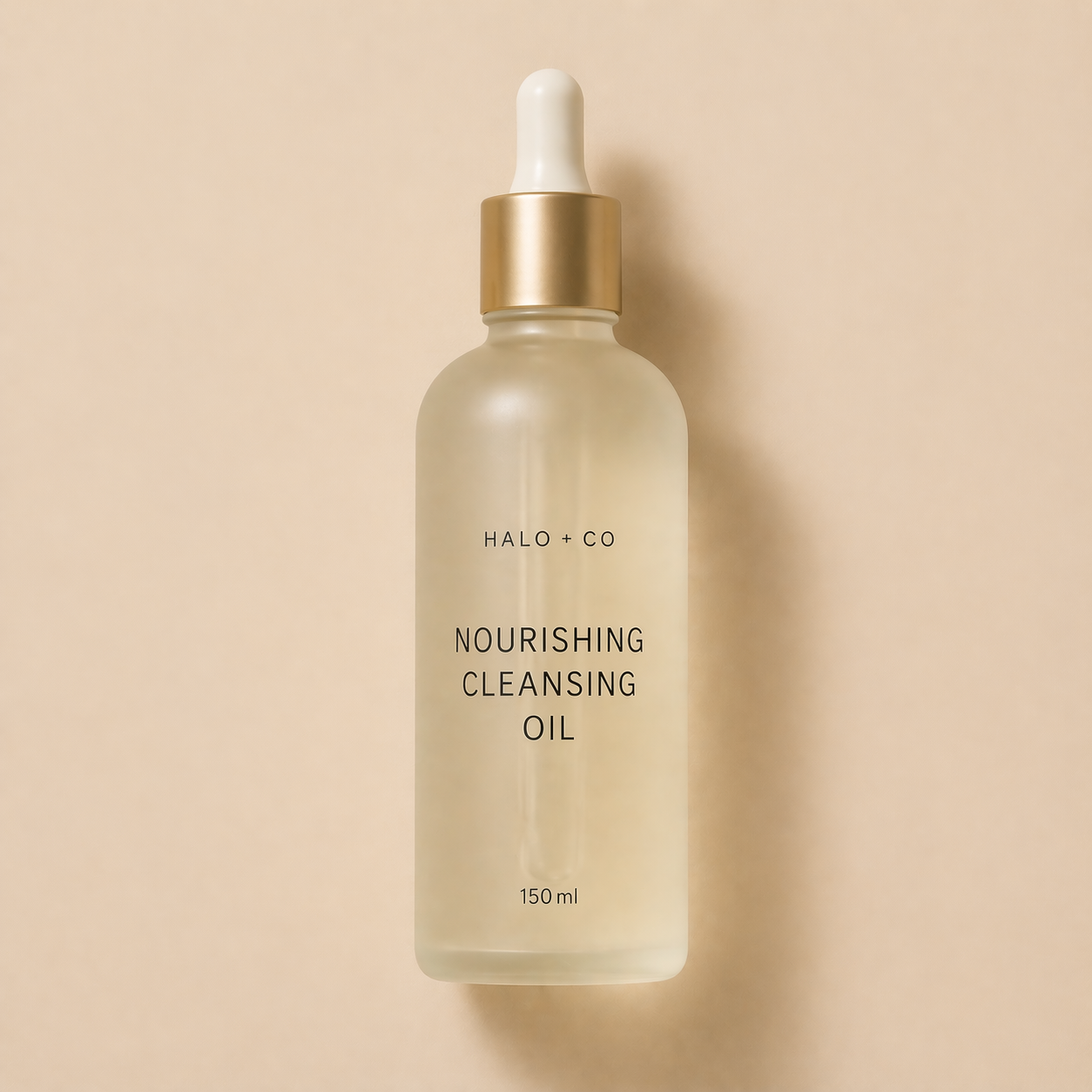 Halo + Co Nourishing Cleansing Oil on warm beige background