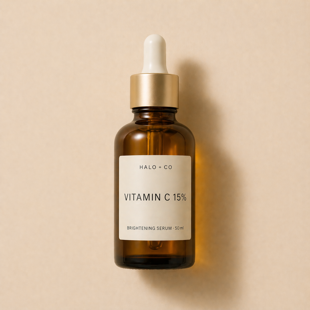 Halo + Co Vitamin C Brightening Serum on warm beige background